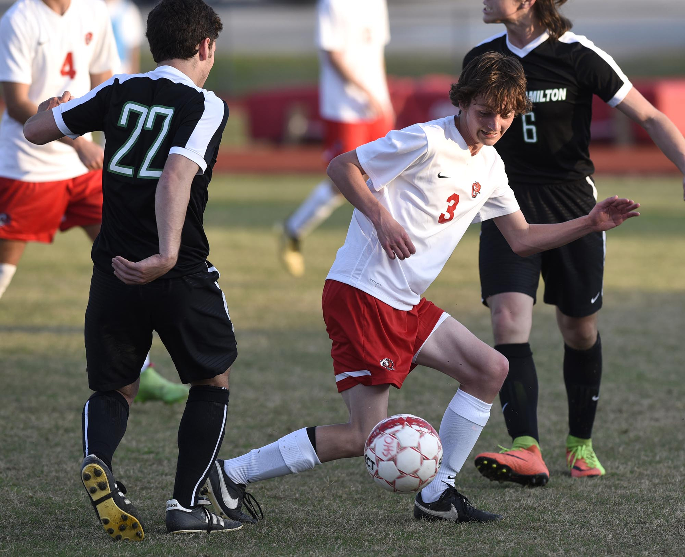 Ooltewah's Jonathan Gross (3) blocks the pass of East Hamilton's Alex Segar (22). The East Hamilton Hurricanes visited the Ooltewah Owls in boys TSSAA soccer action on March 29, 2017.