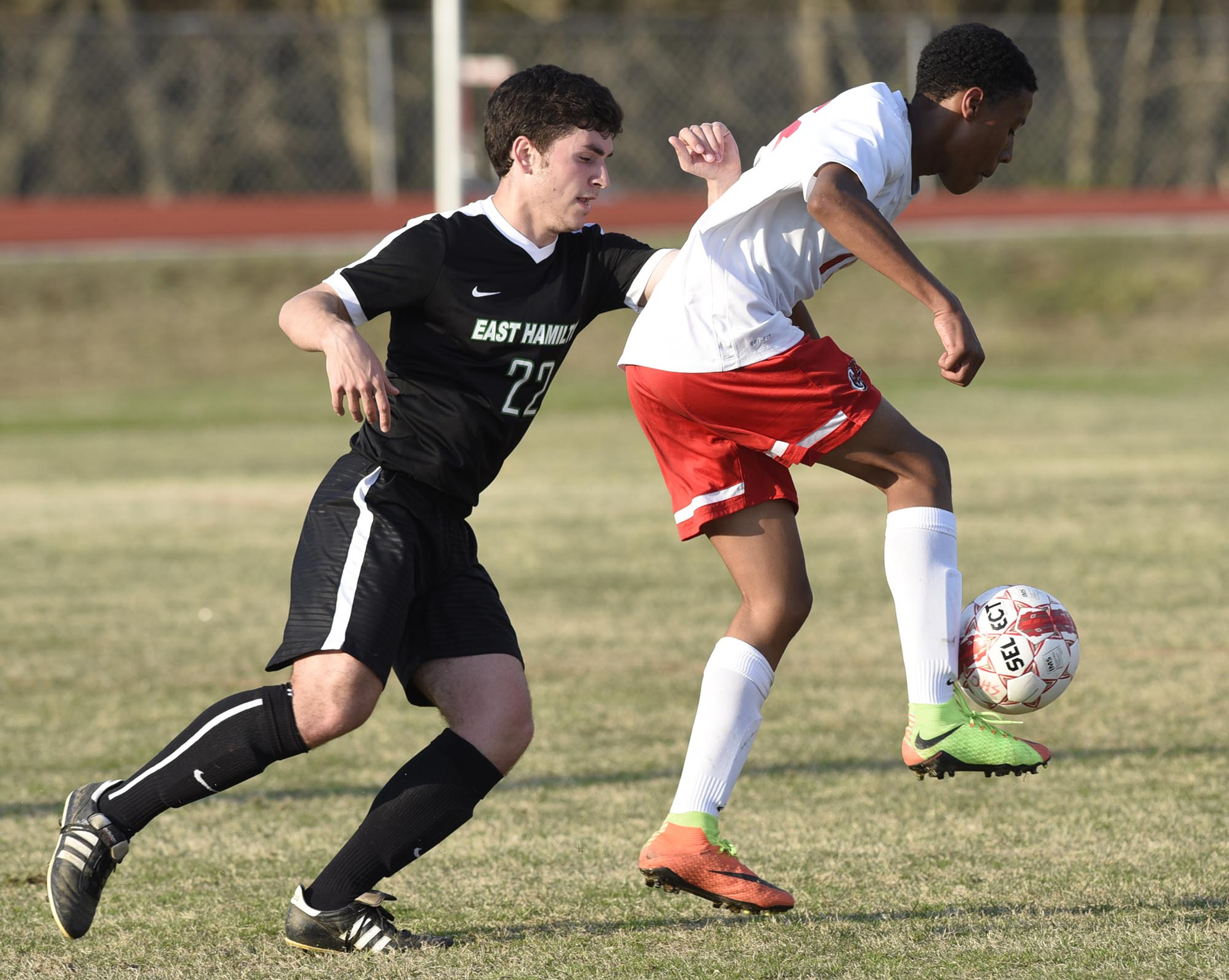 Ooltewah's Gomer Bryon (16) turns the ball as East Hamilton's Alex Segar (22) defends. The East Hamilton Hurricanes visited the Ooltewah Owls in boys TSSAA soccer action on March 29, 2017.