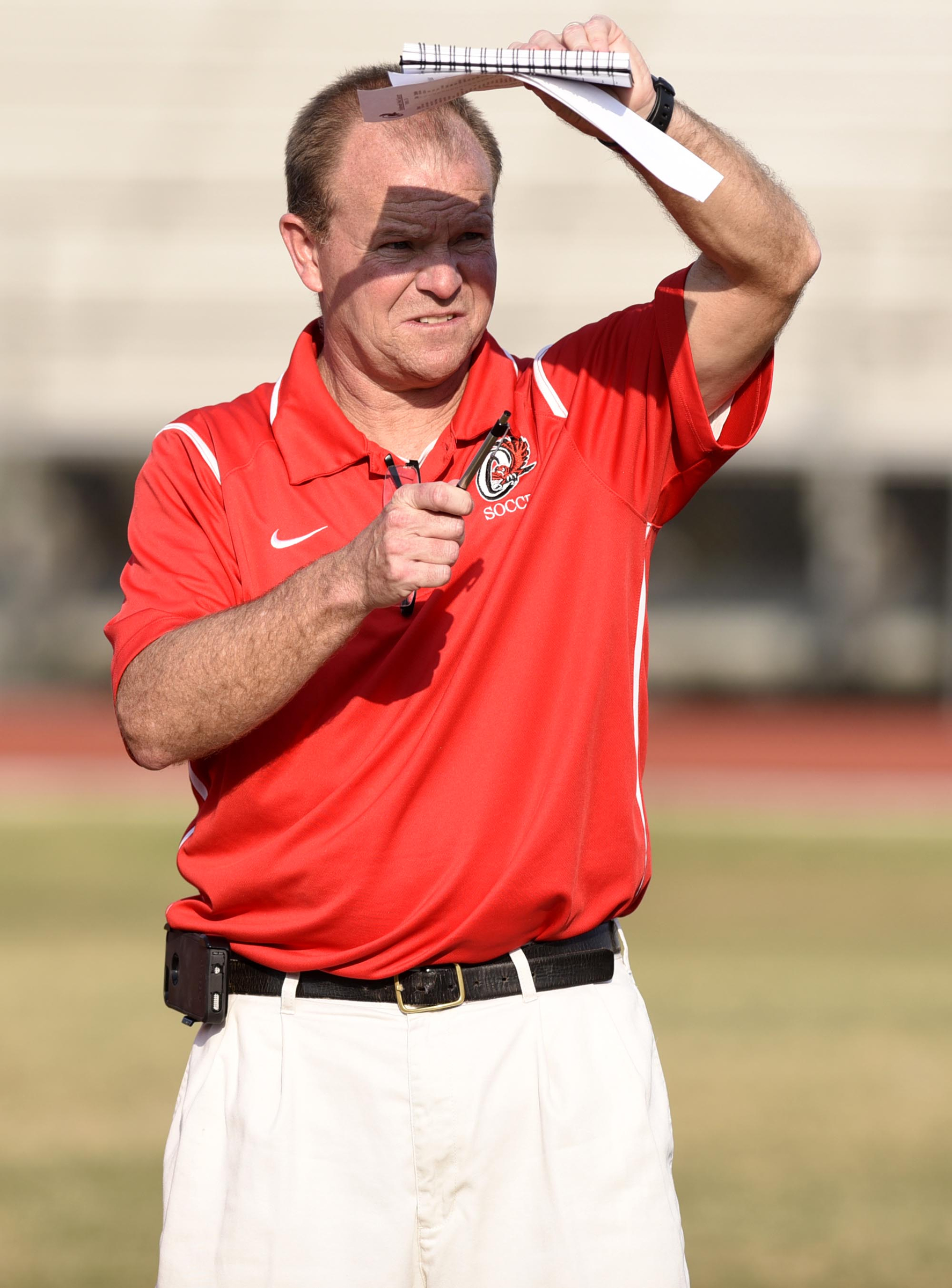 Ooltewah soccer coach Rick Adolph counts off his players before the game. The East Hamilton Hurricanes visited the Ooltewah Owls in boys TSSAA soccer action on March 29, 2017.
