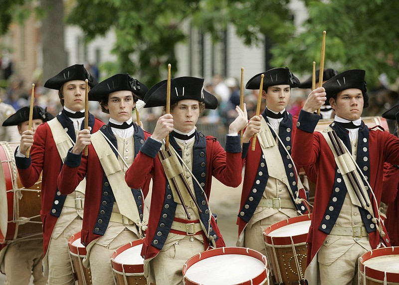 Members of the Colonial Williamsburg Fifes and Drums march prior to the carriage procession of Queen Elizabeth II and Prince Philip  historic Colonial Williamsburg, Va.Thursday, May 3, 2007. (AP Photo/Gerald Herbert)