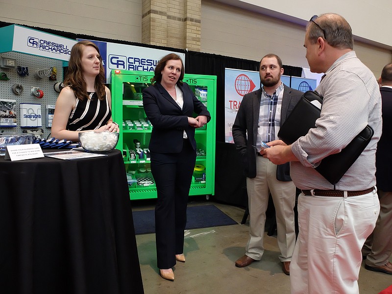 Creswell Richardson representatives Brittany Day, left, Amy Carlton and Justin Davis talk with Bruce Wallace Wednesday at the Chattanooga Area Chamber of Commerce 2017 Small Business Expo at the Chattanooga Convention Center.