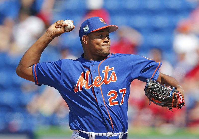 
              New York Mets relief pitcher Jeurys Familia (27) works against the St. Louis Cardinals in the eighth inning of a spring training baseball game Tuesday, March 28, 2017, in Port St. Lucie, Fla. The game ended in a 3-3 tie. (AP Photo/John Bazemore)
            