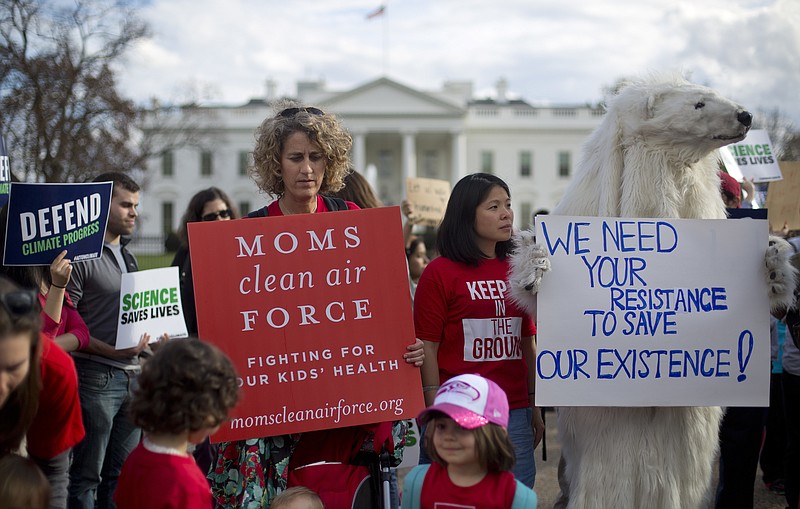 
              FILE - In this Tuesday, March 28, 2017 file photo, demonstrators gather in front of the White House in Washington, during a rally against President Donald Trump's Energy Independence Executive order. Environmental groups are preparing to go to court to battle Trump's efforts to roll back his predecessor's plans to curb global warming. But they say their first order of business is to mobilize a public backlash against an executive order Trump signed on Tuesday that eliminates many restrictions of fossil fuel production. (AP Photo/Pablo Martinez Monsivais, File)
            