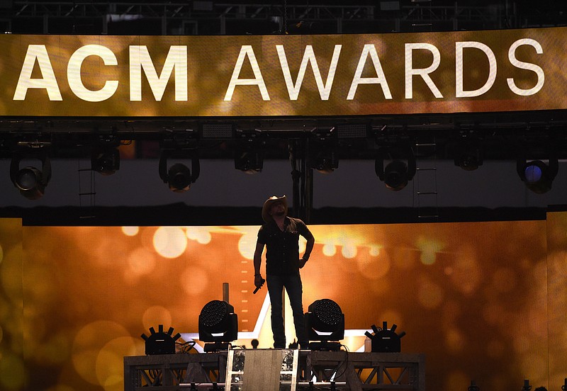 
              FILE - In this April 19, 2015 file photo, Jason Aldean performs at the 50th annual Academy of Country Music Awards at AT&T Stadium in Arlington, Texas.   The ACM Awards, airing Sunday, April 2, 2017 on CBS  are relying on two likable co-hosts, tried and true stars of the format, cross-genre collaborations, a party vibe and new music to keep fans tuned in.(Photo by Chris Pizzello/Invision/AP)
            