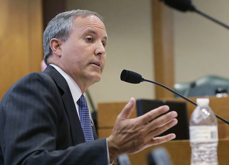 
              FILE - In this July 29, 2015, file photo, Texas Attorney General Ken Paxton speaks during a hearing in Austin, Texas. On the brink of bringing Paxton to trial on felony securities fraud charges, the government's prosecutors are threatening to bail out of the case unless they get paid. Paxton, a stockbroker and state lawmaker before being elected attorney general two years ago, was indicted for allegedly steering investors to a technology startup in 2011 without disclosing that he was being paid by the company. The trial is scheduled to start May 1, 2017. (AP Photo/Eric Gay, File)
            