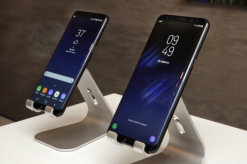 
              In this Friday, March 24, 2017, photo, new Samsung Galaxy S8, left, and Galaxy S8 Plus mobile phones are displayed in New York. The Galaxy S8 features a larger display than its predecessor, the Galaxy S7, and sports a voice assistant intended to rival Siri and Google Assistant. (AP Photo/Richard Drew)
            