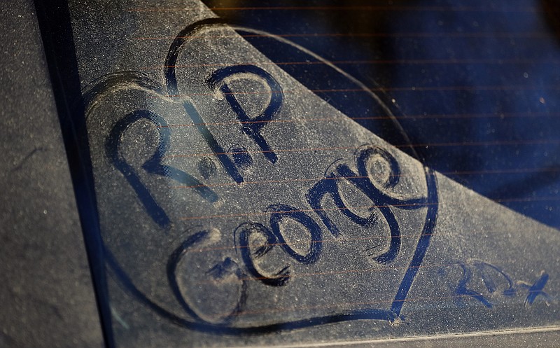 
              FILE - In this file photo dated Tuesday, Dec. 27, 2016, a message written by a fan on a dusty car window outside the home of British musician George Michael in London.  A private funeral took place Wednesday March 29, 2017, at Highgate Cemetery, north London, according to a statement released by Michael’s publicity agency, Connie Filippello Publicity, saying the funeral was attended by family and close friends. (AP Photo/Frank Augstein, FILE)
            