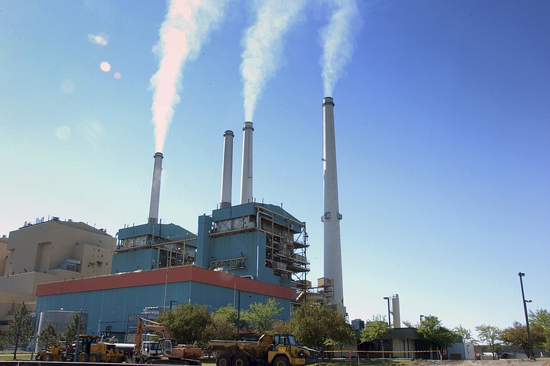 
              FILE - In this July 1, 2013, file photo, smoke rises from the Colstrip Steam Electric Station, a coal burning power plant in Colstrip, Mont. President Trump's latest move to support coal mining is unlikely to turn around the industry's prospects immediately. Experts say the biggest problem faced by the mining industry today isn't a coal shortage of coal or even the prospect of climate change regulations, but an abundance of cheap natural gas. (AP Photo/Matthew Brown, File)
            