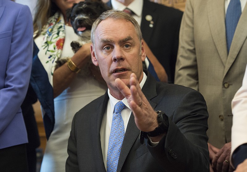 
              Interior Secretary Ryan Zinke speaks at the Interior Department in Washington, Wednesday, March 29, 2017, after signing an order lifting a moratorium on new coal leases on federal lands and a related order on coal royalties.  (AP Photo/Molly Riley)
            