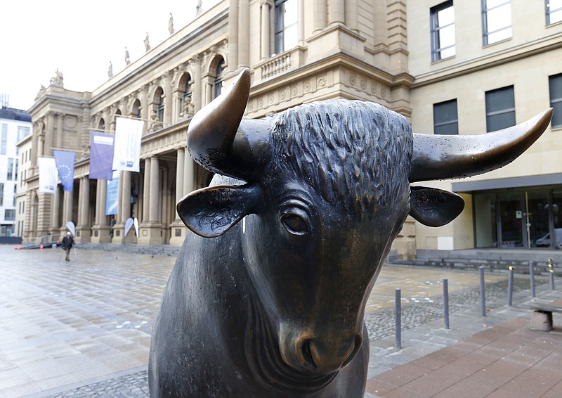 
              FILE - In this Feb. 23, 2016 file photo the bull statue stands in front of the stock market in Frankfurt, Germany. The European Union blocked the proposed merger of Germany's Deutsche Boerse and the London Stock Exchange on Wednesday, March 29, 2017 saying that it had "very serious" concerns about the deal's impact on competition. (AP Photo/Michael Probst)
            