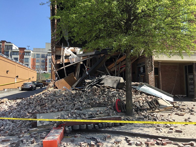 Safety personnel have placed "do not cross" tape over concerns the building that houses Cheeburger Cheeburger might collapse across Aquarium Way on Market Street in downtown Chattanooga.
