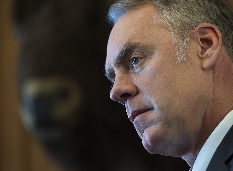 
              Interior Secretary Ryan Zinke speaks at the Interior Department in Washington, Wednesday, March 29, 2017. Zinke said geographic and physical challenges will make it difficult to build the "big, beautiful wall" that President Donald Trump has promised on the U.S.-Mexico border.  (AP Photo/Molly Riley)
            