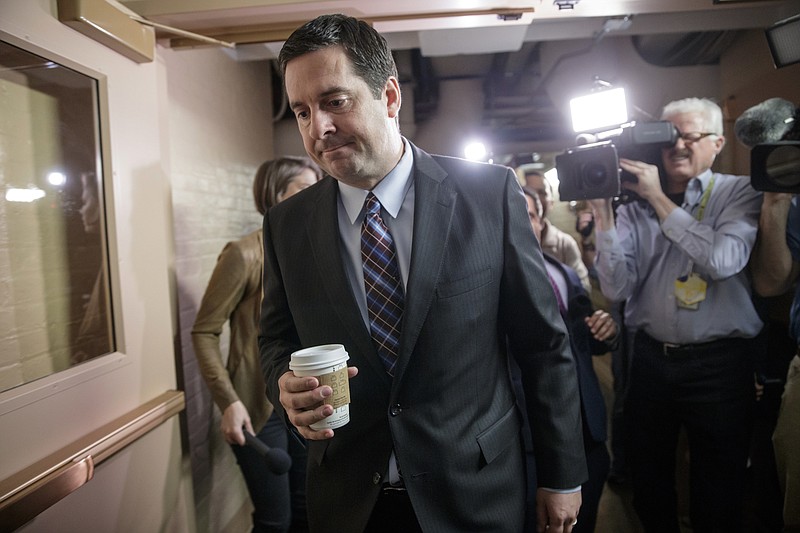 
              House Intelligence Committee Chairman Rep. Devin Nunes, R-Calif. is pursued by reporters as he arrives for a weekly meeting of the Republican Conference with House Speaker Paul Ryan and the GOP leadership, Tuesday, March 28, 2017, on Capitol Hill in Washington. Nunes is facing growing calls to step away from the panel's Russia investigation as revelations about a secret source meeting on White House grounds raised questions about his and the panel's independence. (AP Photo/J. Scott Applewhite)
            