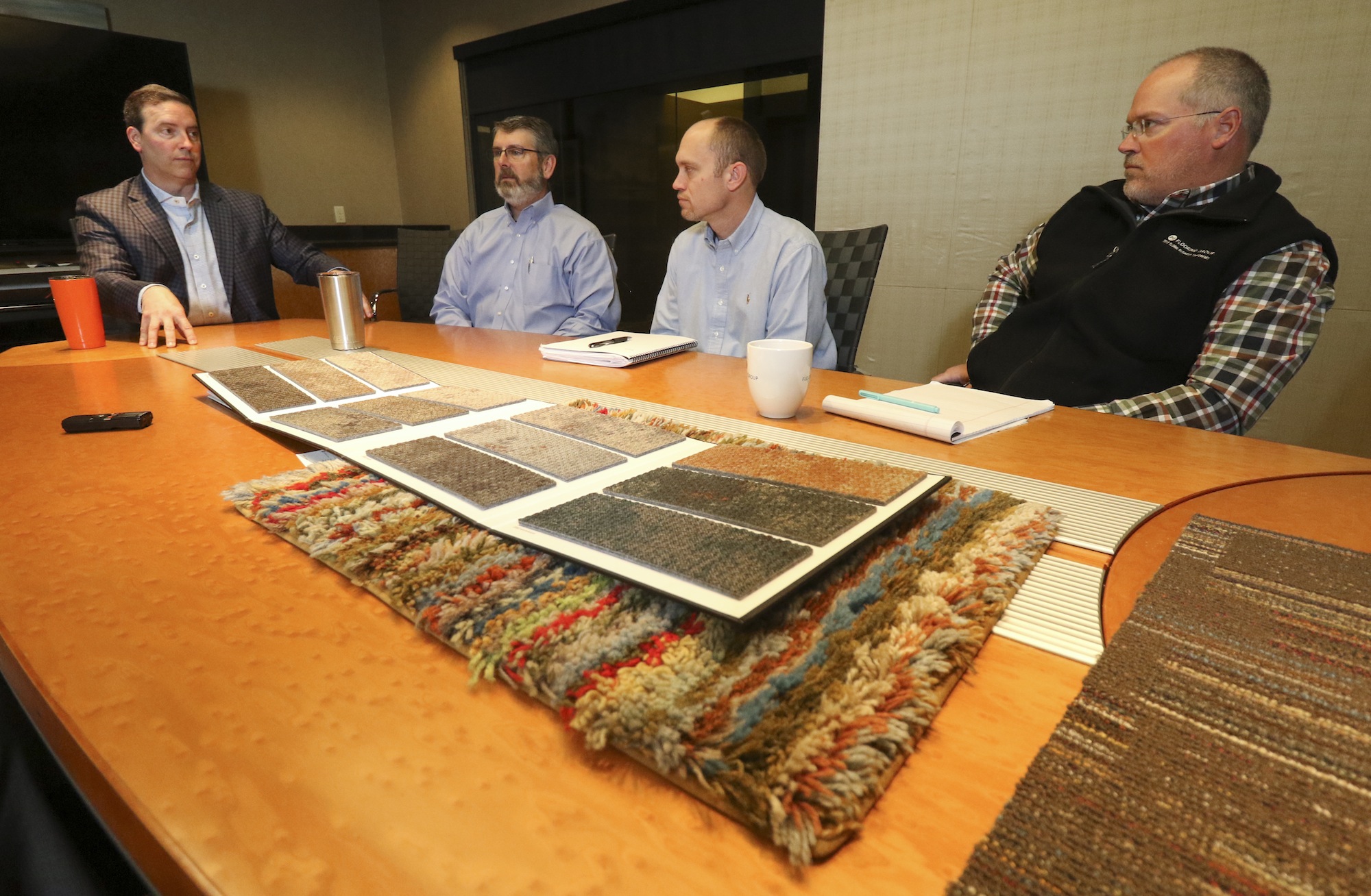 Staff Photo by Dan Henry / The Chattanooga Times Free Press- 3/16/17. David Jolly, left, president of J+J Flooring Group speaks about the 60-years his family's business has been producing soft flooring.
