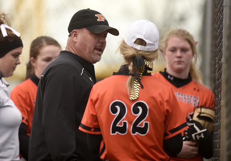 South Pittsburg softball coach Vic Grider talks to his team, including daughter Victoria Grider (22), during a game at Lookout Valley on March 17. The Lady Pirates returned there last weekend and went 5-0 in the Lady Yellow Jackets' home tournament.