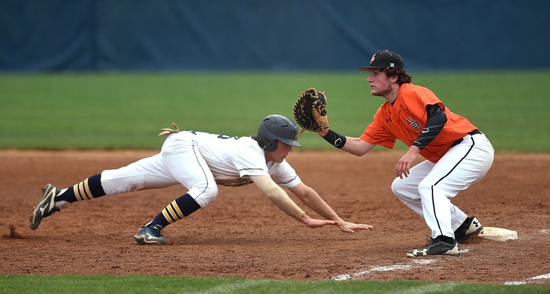 Chattanooga Christian's Chris King slides safely back to first base as South Pittsburg's Travis Rowell waits for the ball on Thursday.