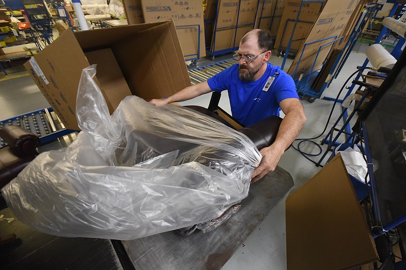Staff photo by Tim Barber Chuck Schaffer packages the standard La-Z-Boy recliner before boxing it for shipping in Plant 6 at the Dayton facility. La-Z-Boy is adding 115 jobs in Dayton, which should help Rhea County where last month the 8.8 percent unemployment rate was the highest of any of Tennessee's 95 counties.