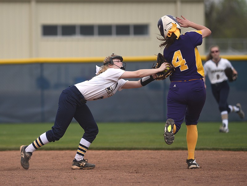 Chattanooga Christian's Anslee Walker tags Sequatchie County's Hadley Gray near second base Thursday, March 30, 2017 at Chattanooga Christian School.