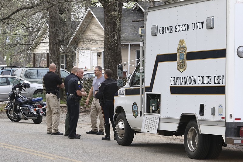 Chattanooga Police gather evidence from a secondary scene early Thursday morning a block from an overnight shooting that occurred at 3500 Clio Avenue, near Rossville Blvd., and resulted in one dead and one injured.