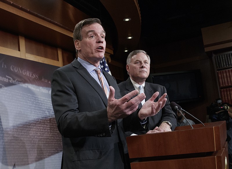 
              Senate Intelligence Committee Vice Chairman Sen. Mark Warner, D-Va., left, with Committee Chairman Sen. Richard Burr, R-N.C., speaks during a news conference on Capitol Hill in Washington, Wednesday, March 29, 2017, to discuss their panel's investigation of Russian interference in the 2016 election. (AP Photo/J. Scott Applewhite)
            