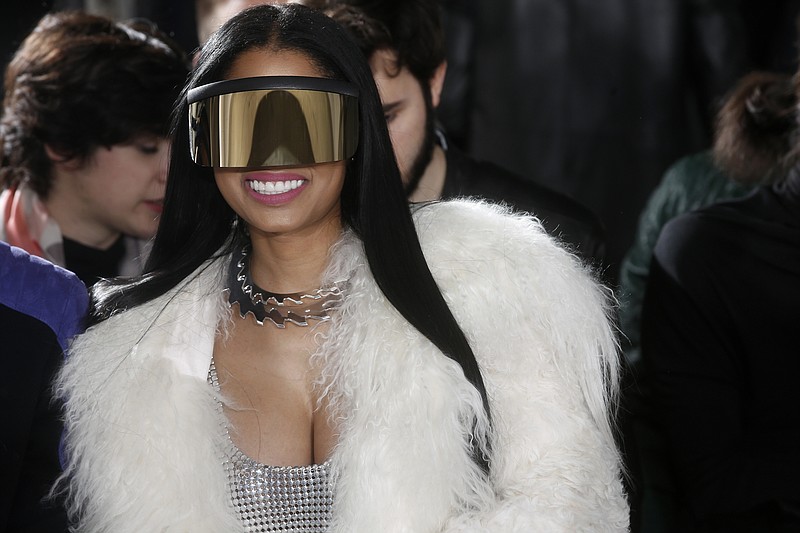 
              FILE - In this March 2, 2017, file photo, singer Nicki Minaj attends Rick Owens' Fall-Winter 2017-2018 ready to wear fashion collection presented in Paris. Celebrities including Nicky Minaj and Alanis Morissette are among the victims of what police suspect is "flocking," so named because gang members flock like birds to areas where home burglaries provide the biggest payoff.   (AP Photo/Thibault Camus, File)
            