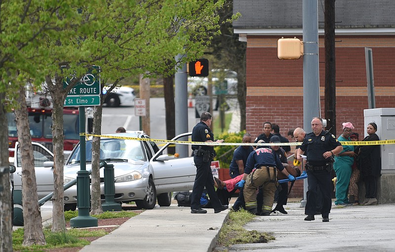 Emergency personnel work the scene of a shooting Friday, March 31, 2017 in the 3800 block of Alton Park Boulevard.