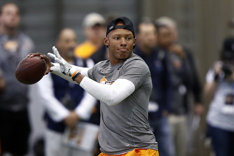 Quarterback Josh Dobbs throws to a receiver during Tennessee NFL Pro Day on Friday, March 31, 2017, in Knoxville, Tenn. (AP Photo/Wade Payne)