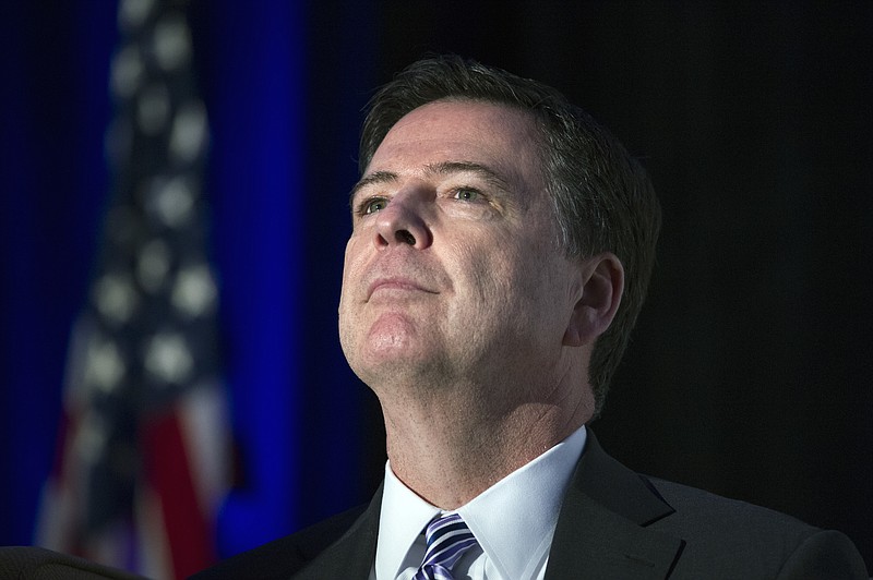 
              FILE - This March 29, 2017, file photo shows FBI Director James Comey as he pauses while speaking at the Intelligence and National Security Alliance Leadership Dinner in Alexandria, Va. A reporter for the website Gizmodo says she's uncovered a stealth Twitter account that she believes belongs to FBI Director James Comey. (AP Photo/Cliff Owen, File )
            