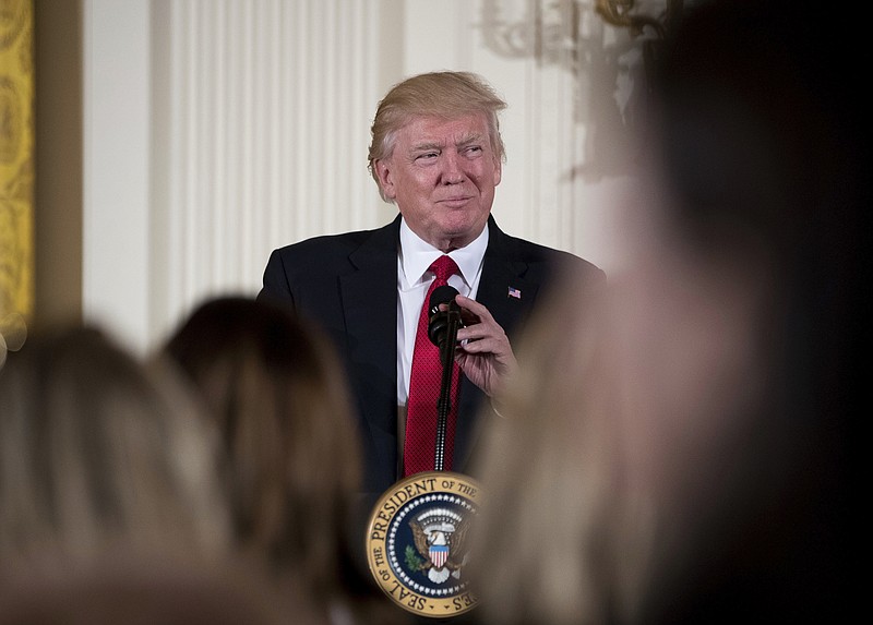 
              FILE - In this March 29, 2017 file photo, President Donald Trump pauses while speaking in the East Room of the White House in Washington. A new survey shows most Americans disapprove of President Donald Trump’s performance, but they’re more upbeat about how he’s handling the economy. (AP Photo/Andrew Harnik, File)
            