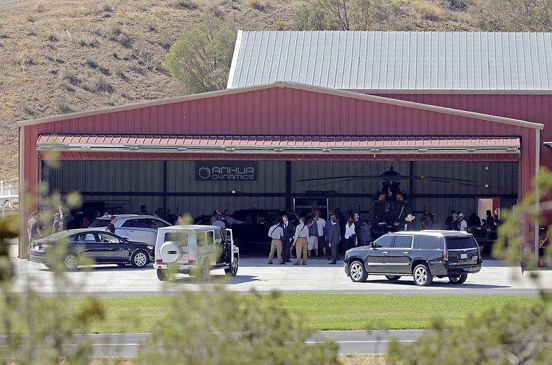 
              FILE - In this Wednesday, July 6, 2016 file photo, members of a film crew stand at Agua Dulce Airpark, a small, rural airport in Agua Dulce, Calif., in northern Los Angeles County.   Records show that actor Tom Sizemore was not supposed to drive a vehicle during the filming of a scene for the “Shooter” television series in which he ran over a stuntman, leaving him seriously injured. Multiple people working on the show told a workplace safety investigator for Cal/OSHA that Sizemore was not following the script when he drove the sport utility vehicle away from a shootout scene.(AP Photo/Reed Saxon)
            