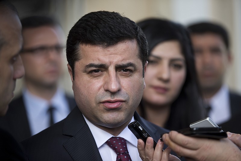 
              FILE- In this Monday, Feb. 15, 2016 file photo, Turkish co-chairman of pro-Kurdish People's Democratic Party, or HDP, Selahattin Demirtas speaks with journalists after his meeting with Greek Prime Minister Alexis Tsipras, in Athens. The jailed leader of Turkey's pro-Kurdish party says he is embarking on a hunger strike to protest prison conditions, he said in a statement released by his party on Friday, March, 31, 2017. (AP Photo/Petros Giannakouris, File)
            