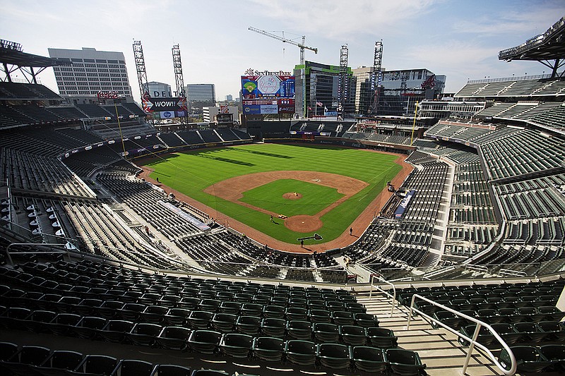 A view from the press box of SunTrust Park, the Atlanta Braves' new baseball stadium in Atlanta, Wednesday, March 29, 2017. The Braves' new ballpark looks like a throwback stadium with its green seats, brick walls and its old-school, intimate feel. That's from an initial glance inside the park. Beyond the stadium walls sits the real wow factor that could be a game-changer for the industry. (AP Photo/David Goldman)