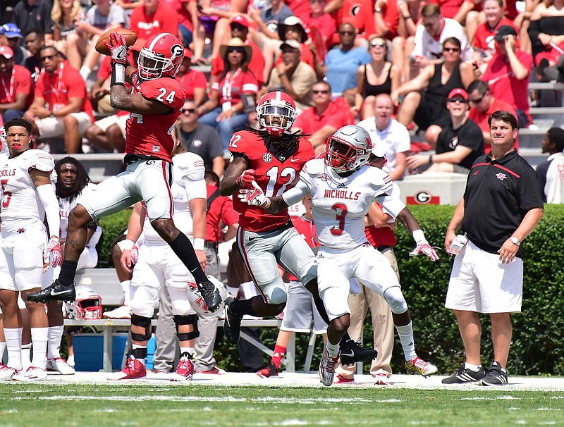 Georgia strong safety Dominick Sanders (24) snags an interception during last season's 26-24 escape of Nicholls State.