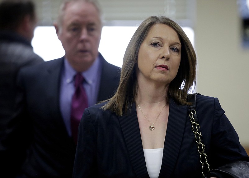 
              In a Thursday, Dec. 15, 2016 file photo, Tulsa Police Officer Betty Shelby leaves the Tulsa County Courthouse after her court appearance, in Tulsa, Okla., where she was arraigned on a first-degree manslaughter charge, stemming from the September shooting death of Terence Crutcher. Shelby tells “60 Minutes” in an episode set to air Sunday, April 2, 2017, that she used lethal force because she feared 40-year-old Crutcher was reaching inside his SUV for a gun. She has pleaded not guilty and goes to trial May 8.   (Mike Simons/Tulsa World via AP.,File)
            