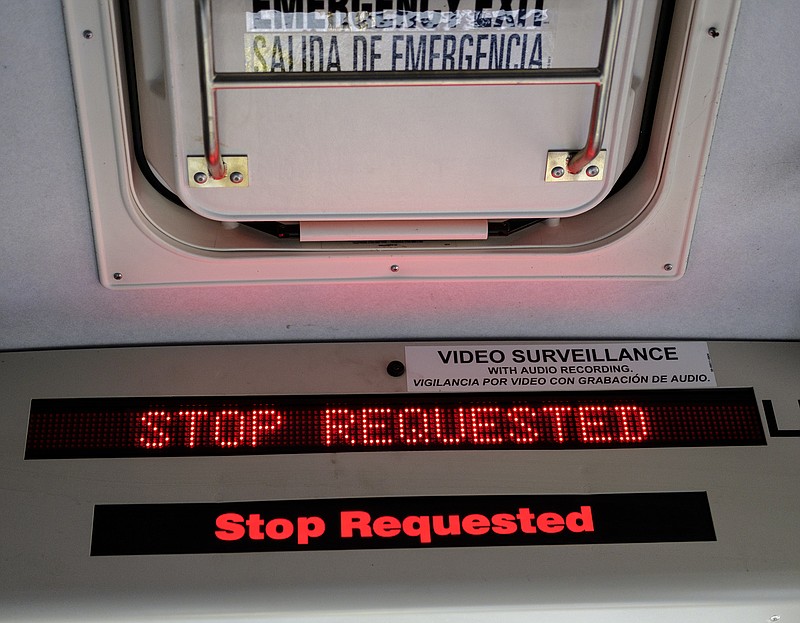 A sign indicates a stop was requested on a CARTA bus route.