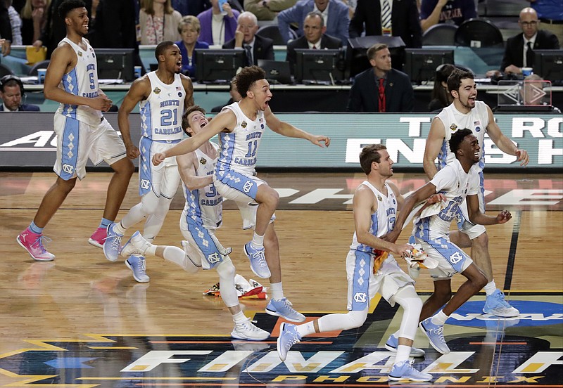 North Carolina players celebrate after the finals of the Final Four NCAA college basketball tournament against Gonzaga, Monday, April 3, 2017, in Glendale, Ariz. North Carolina won 71-65. (AP Photo/Matt York)