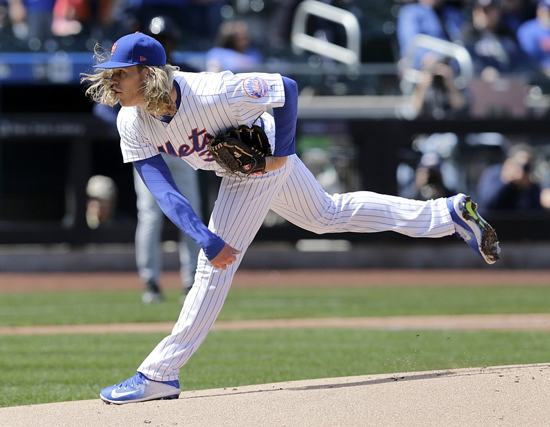 New York Mets starting pitcher Noah Syndergaard (34) throws the first pitch in the first inning of a baseball game at Citi Field against the Atlanta Braves, Monday, April 3, 2017, in New York. (AP Photo/Seth Wenig)