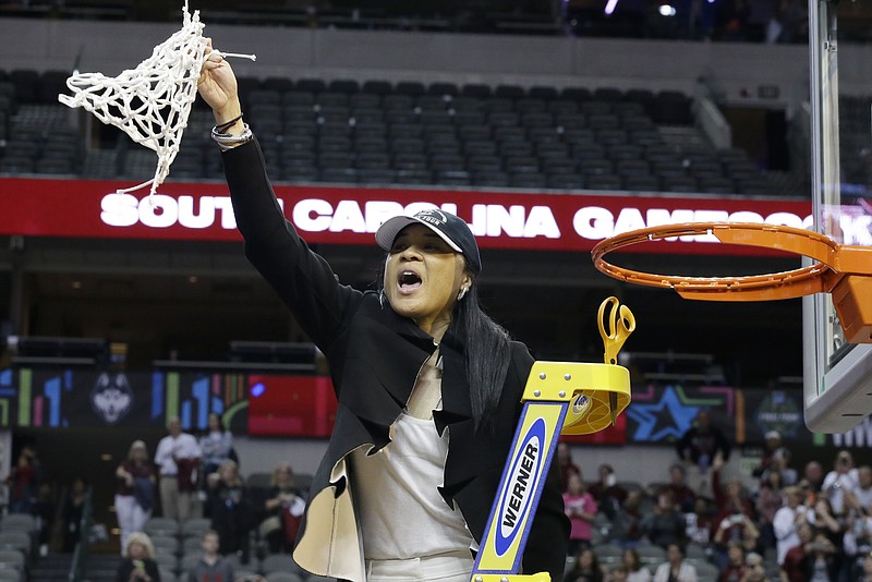 
              South Carolina coach Dawn Staley cuts down the net as she and the team celebrate their win over Mississippi State in the final of NCAA women's Final Four college basketball tournament, Sunday, April 2, 2017, in Dallas. South Carolina won 67-55. (AP Photo/LM Otero)
            