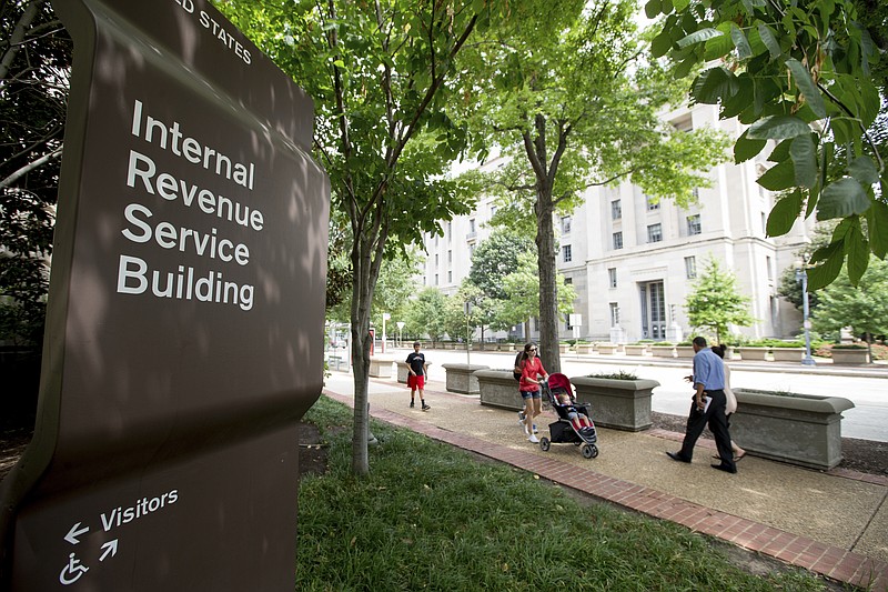 
              In this photo taken Aug. 19, 2015, the Internal Revenue Service Building in Washington. The IRS says it is once again using private debt collectors to go after tax delinquents. The resumption of the program comes amid a wave of telephone scams in which fake IRS agents try to con innocent taxpayers out of their money. (AP Photo/Andrew Harnik)
            