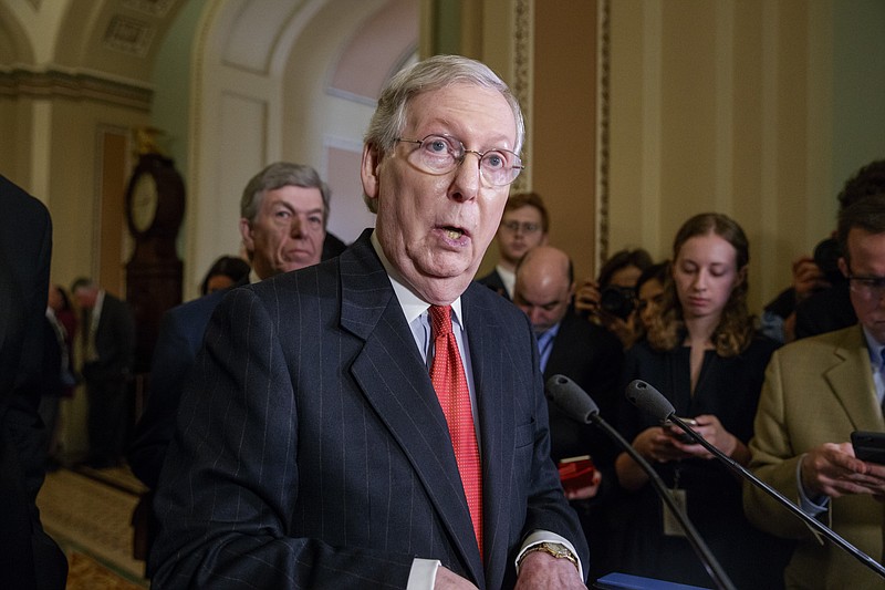 Senate Majority Leader Mitch McConnell speaks with reporters following a closed-door strategy session this week on Capitol Hill. (AP Photo/J. Scott Applewhite)