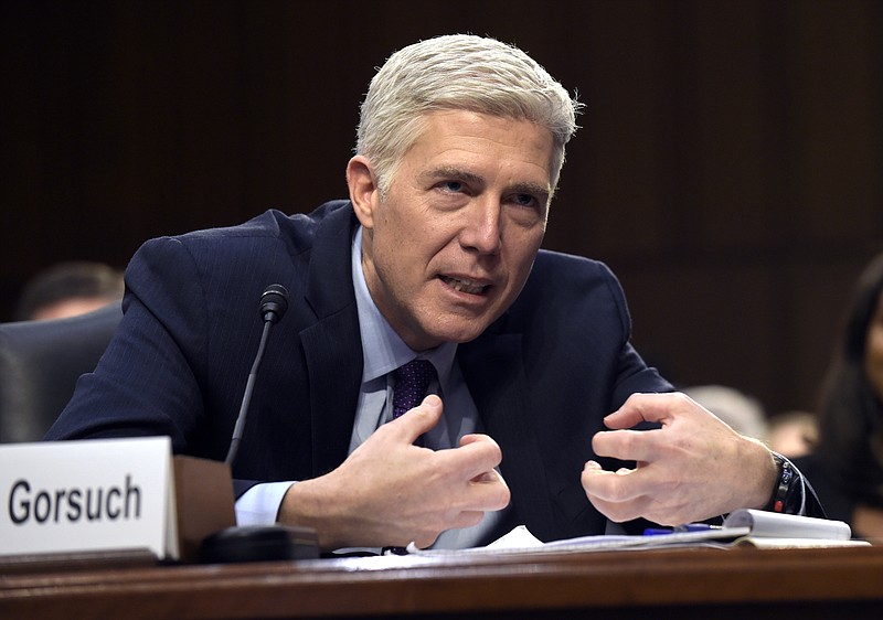 In this March 21, 2017, file photo, Supreme Court Justice nominee Judge Neil Gorsuch explains mutton busting, an event held at rodeos similar to bull riding or bronc riding, in which children ride or race sheep, as he testifies on Capitol Hill in Washington during his confirmation hearing before the Senate Judiciary Committee. The Senate Judiciary Committee is expected to vote on Gorsuch's nomination on April 3. (AP Photo/Susan Walsh, File)