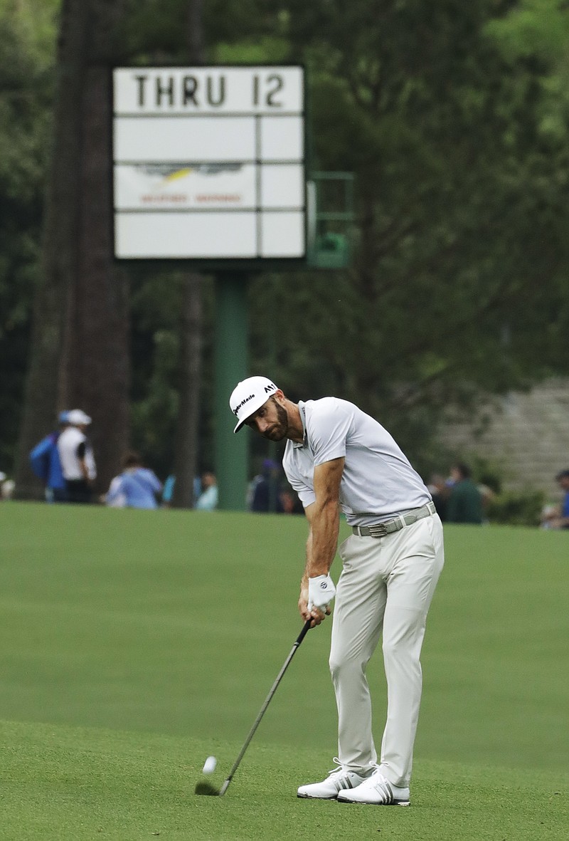 
              Dustin Johnson hits on the 13th hole during a practice round for the Masters golf tournament Wednesday, April 5, 2017, in Augusta, Ga. (AP Photo/Matt Slocum)
            