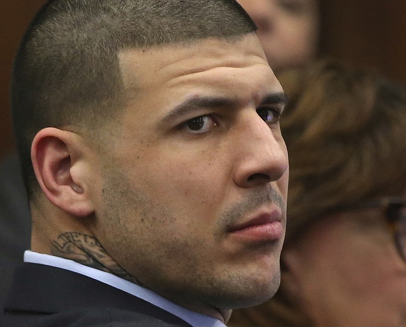 
              Former New England Patriots tight end Aaron Hernandez listens to testimony during his double murder trial in Suffolk Superior Court in Boston, Wednesday, April 5, 2017.  Hernandez is standing trial for the July 2012 killings of Daniel de Abreu and Safiro Furtado, who he encountered in a Boston nightclub. The former NFL player is already serving a life sentence in the 2013 killing of semi-professional football player Odin Lloyd.  (Nancy Lane/The Boston Herald via AP, Pool)
            