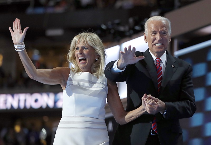 
              FILE - In this July 27, 2016 file photo, Dr. Jill Biden and Vice President Joe Biden wave after speaking to delegates during the third day session of the Democratic National Convention in Philadelphia. Flatiron Books said Wednesday, April 5, 2017, that it will release two books by Joe Biden and one by Jill. Joe Biden’s first book will “explore one momentous year,” 2016, when his son Beau died and he decided against running for president. The book is currently untitled and no release date was announced. (AP Photo/Carolyn Kaster, File)
            