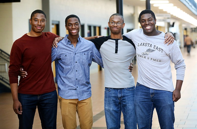 
              Lakota East seniors and quadruplet brothers from left, Zachary, Aaron, Nigel, and Nick Wade pose together at Lakota East High School, in Liberty Township, Ohio, Wednesday, April 5, 2017. All the brothers have been accepted at some of the nation's top universities, including each of them to both Yale and Harvard. (Greg Lynch /The Journal-News via AP)
            
