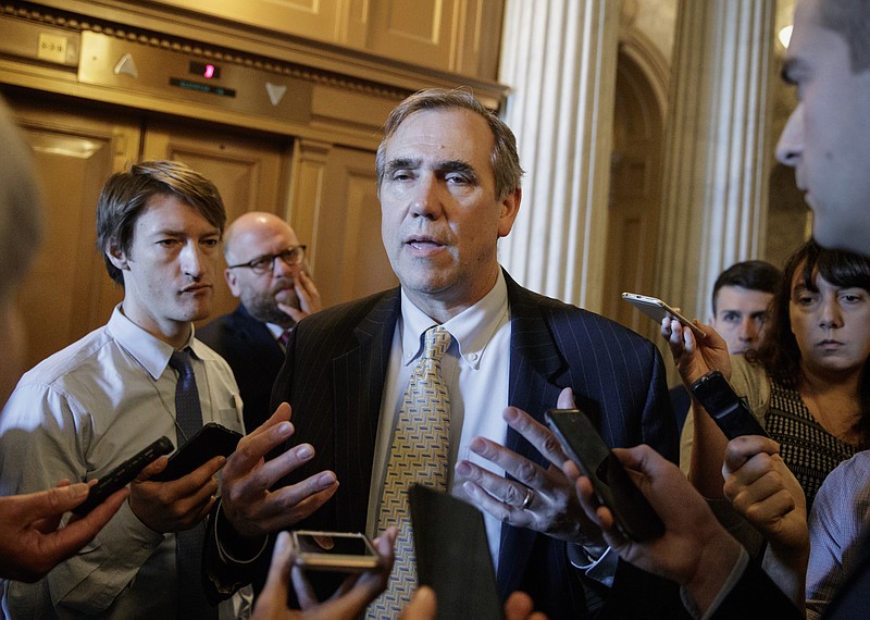 
              Sen. Jeff Merkley, D-Ore. speaks to reporters just outside the Senate chamber on Capitol Hill in Washington, Wednesday, April 5, 2017, after he ended a 15 hour all-night talk-a-thon as the Senate heads toward a showdown over the confirmation vote for Supreme Court Justice nominee Neil Gorsuch. (AP Photo/J. Scott Applewhite)
            