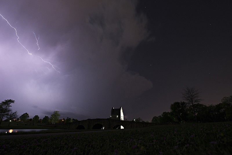 
              Lightning runs through cloud over Blount Cultural Park in Montgomery, Ala., Wednesday, April 5, 2017, as a thunderstorm moves through southern Montgomery County. A powerful tornado toppled trees and downed power lines in rural Georgia and similar scenes played out in spots around Alabama and South Carolina amid drenching rain, high winds and scattered hail - some as big as baseballs. (Albert Cesare/The Montgomery Advertiser via AP)
            