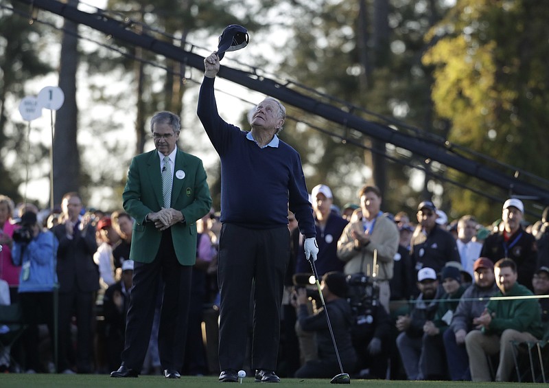 
              Jack Nicklaus looks up to the sky to honor Arnold Palmer before hitting an honorary first tee shot for the ceremonial start of the first round of the Masters golf tournament Thursday, April 6, 2017, in Augusta, Ga. (AP Photo/Chris Carlson)
            