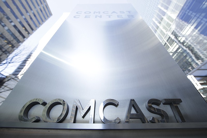 
              This March 29, 2017, photo shows a sign outside the Comcast Center in Philadelphia. Comcast will start selling cellphone plans called Xfinity Mobile in the coming months, using a network it’s leasing from Verizon. Many subscribers will save money, especially if they don’t use a lot of data. The catch: Only Comcast internet customers can sign up. (AP Photo/Matt Rourke)
            