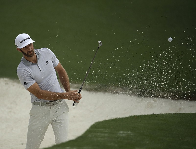 
              Dustin Johnson hits from a bunker on the 10th hole during a practice round for the Masters golf tournament Wednesday, April 5, 2017, in Augusta, Ga. (AP Photo/Charlie Riedel)
            
